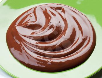 Swirl of smooth chocolate on a plate