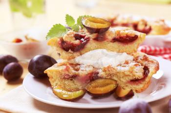 Slices of plum cake with sweet curd cheese