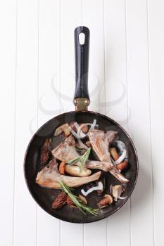 Roast lamb chops and mushrooms on a pan