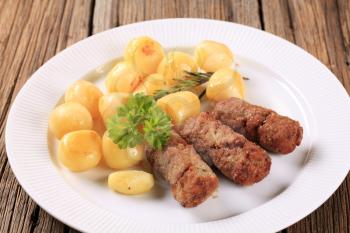 Ground meat fingers and potatoes - closeup