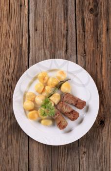 Ground meat finger rolls and potatoes - overhead