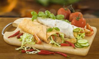 Two chicken and vegetable tortilla wraps 