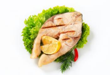 Grilled fish steak with lemon