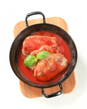 Pork chops with tomato sauce in a skillet