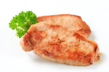 Pan seared pork cutlets on white