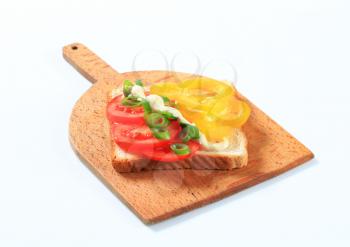 Open faced tomato and pepper sandwich