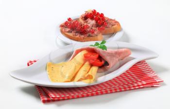 Slices of ham and cheese and bread with pate