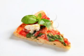 Piece of pizza with cheese, bacon and spinach 