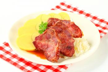 Roast pork with potato dumplings and sauerkraut