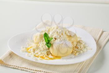 Fruit-filled dumplings with cottage cheese, sugar and butter