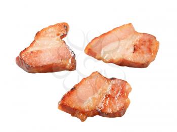 Pieces of pan fried bacon