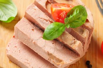 Smooth liver pate on cutting board