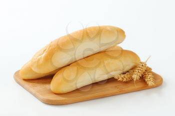 White bread rolls on cutting board