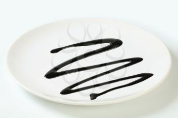 Chocolate syrup drip on plate