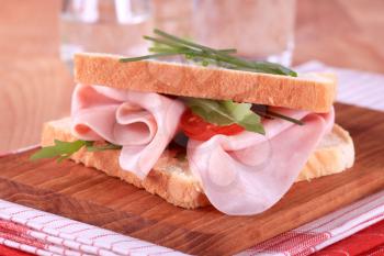 Ham sandwich on a cutting board 
