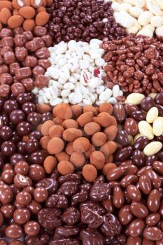 Assortment of chocolate and yogurt covered nuts and fruit 