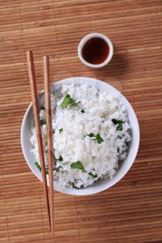 Bowl of white rice and soy sauce