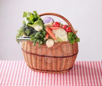 Variety of fresh vegetables in a wicker basket