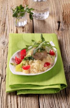 Couscous, button mushroom with pesto and fresh vegetables