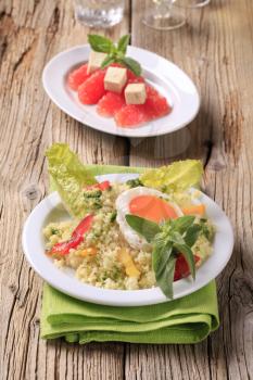 Couscous salad and fried egg, red grapefruit and tofu