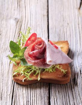 Ham and salami on toast - closeup