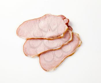 Slices of smoked pork meat - studio shot
