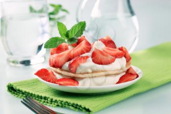 Pancakes with cream cheese and fresh strawberries 