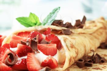 Crepes filled with sweet cream cheese and strawberries