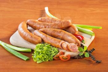 Kielbasa sausages on a wooden cutting board