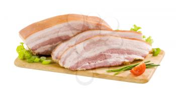 Slices of pork belly on cutting board
