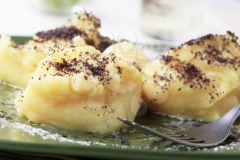 Lumps of potato puree with poppyseed and sugar

