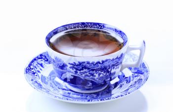 Hot tea in an ornate teacup