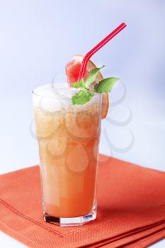 Glass of cocktail with crushed ice - closeup