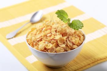 Bowl of crunchy corn flakes - closeup