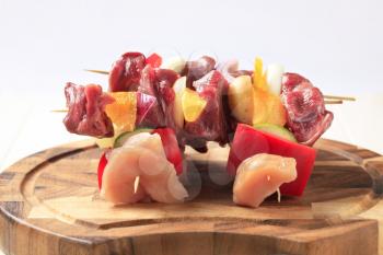 Raw shish kebabs on a cutting board