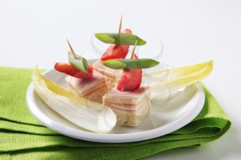 Ham and cheese canapes and endive leaves