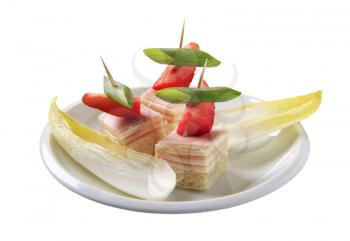 Ham and cheese canapes and endive leaves