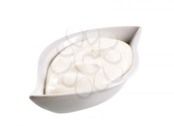 Bowl of white thick cream isolated on white