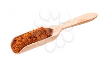 Ground red pepper on a wooden scoop 