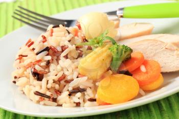 Healthy dish of mixed rice, chicken meat  and vegetables