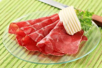 Thin slices of dried meat and butter