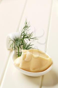 Creamy horseradish sauce on a porcelain spoon