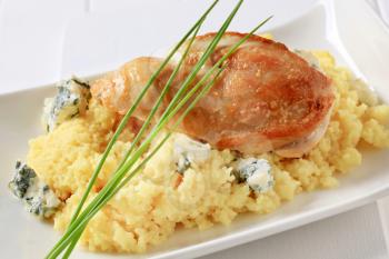 Seared chicken breast served with couscous and blue cheese