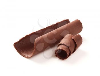 Chocolate curls on white background - closeup