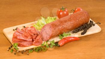 Sausage of salami on a cutting board