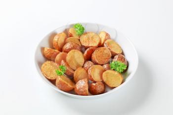 Oven-roasted new potatoes in a porcelain dish