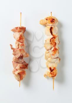 Grilled pork and chicken on skewers