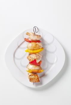 Grilled meat and peppers on skewers