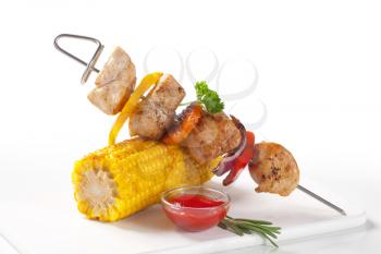 Chicken shish kebab and roasted corn on the cob