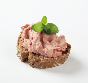 Slice of brown bread and smooth liver pate